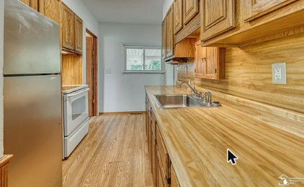 Galley kitchen with butcher block counters