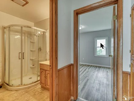 Full bathroom with corner shower stall