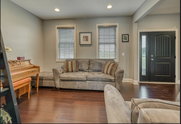 Cozy den with front door view
