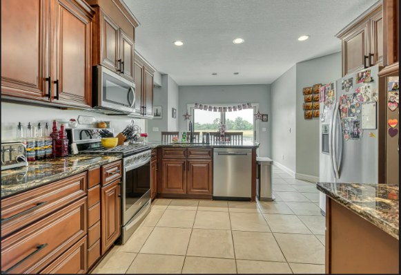 Kitchen with granite counters and stainless appliances