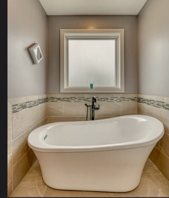 Freestanding soaking tub in the primary bathroom
